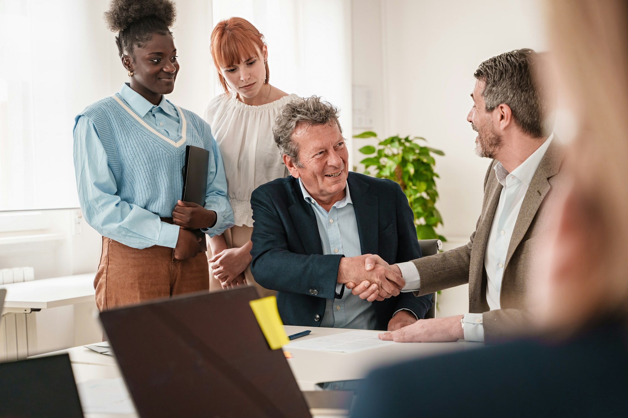 Diverse Business Team Sealing a Partnership with a Handshake